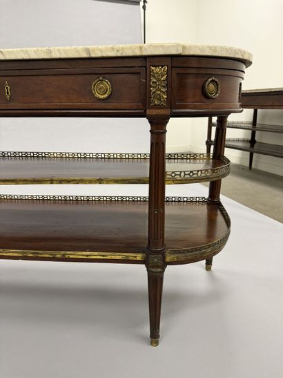 A pair of half-moon-shaped mahogany console...