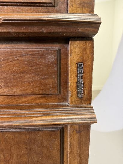Two-section walnut cabinet with four-panel...