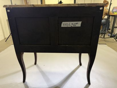 A rosewood and palisander chest of drawers...