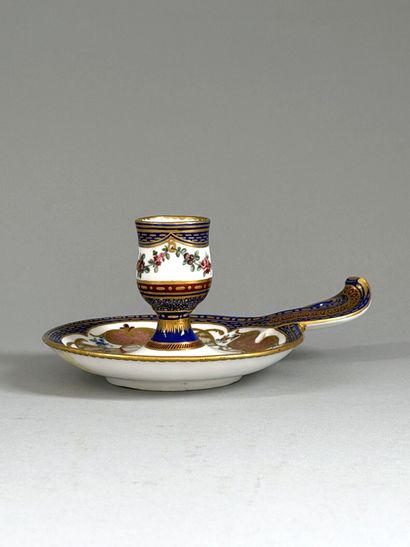 SÈVRES
Soft-paste porcelain hand-held candlestick...