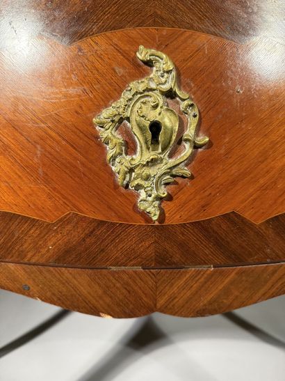 A rosewood and palisander chest of drawers...