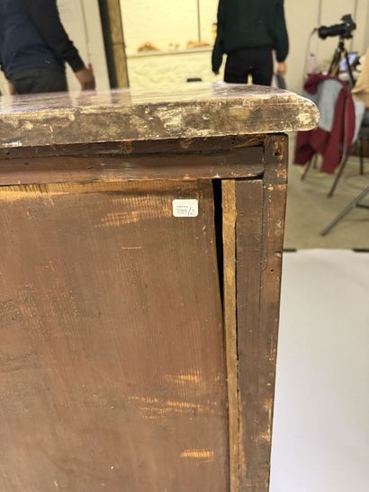 A rosewood chest of drawers with a curvilinear...