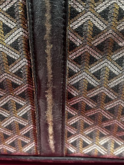 GOYARD
Valise de voyage souple chiffrée 