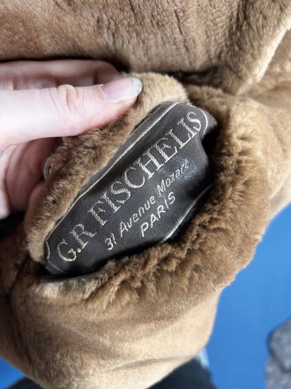 FISCHELIS
Manteau réversible en peau retournée...