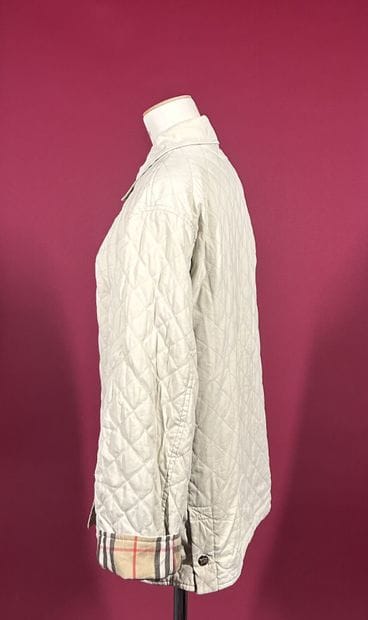 BURBERRYS'
Veste coupe-vent matelassée ivoire...