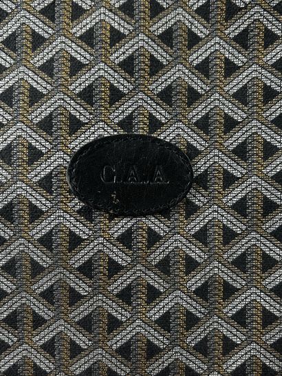 GOYARD
Valise de voyage souple chiffrée 