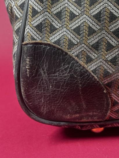 GOYARD
Valise de voyage souple chiffrée 