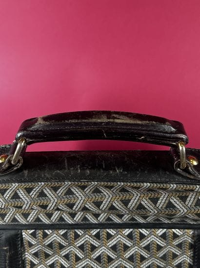 GOYARD
Valise de voyage souple chiffrée 