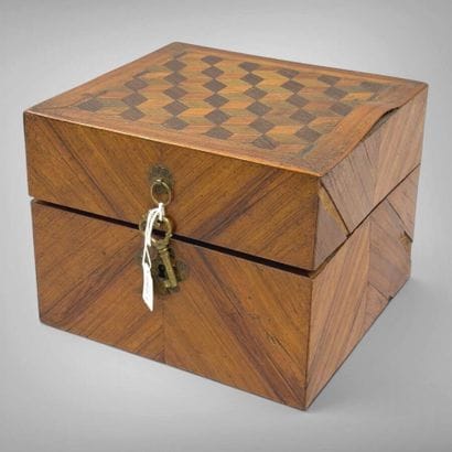 A veneered wood perfume set with a cube-motif...