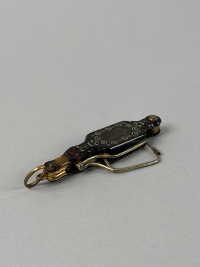 Set including: 
- A silver rattle (800 parts...