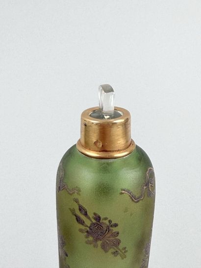 Enameled glass bottle decorated with flowers,...