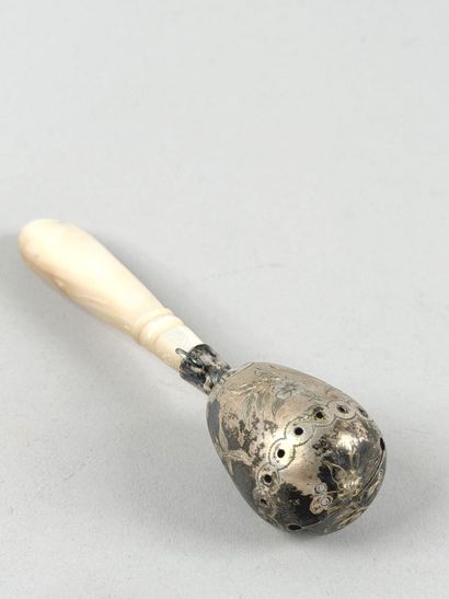 Set including: 
- A silver rattle (800 parts...