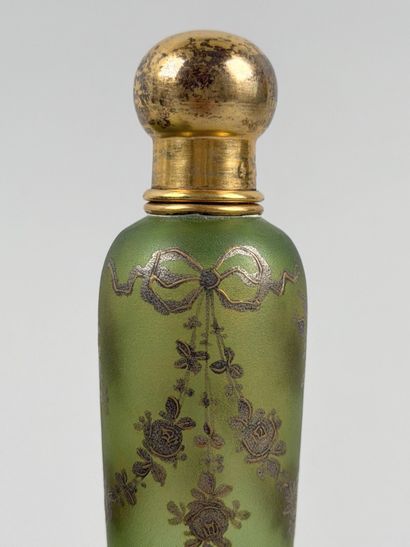 Enameled glass bottle decorated with flowers,...