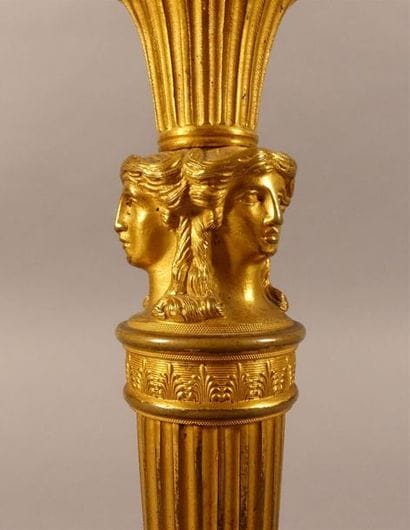 Paire de flambeaux en bronze ciselé et doré,...