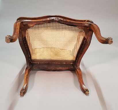 Fauteuil canné en bois teinté à dossier contourné,...