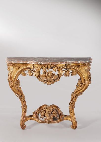 Console en bois doré de forme mouvementée,...