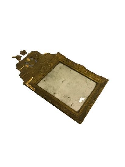 
A carved and gilded wood FRONTIER MIRROR...