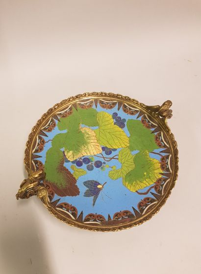 
A gilt bronze cup with a dish decorated...
