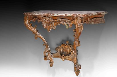 
A natural wood carved console table with...