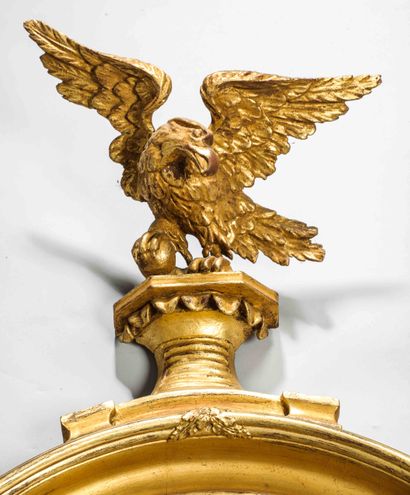 
A large wood and gilded stucco mirror frame,...