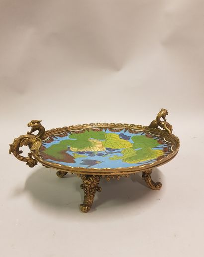 
A gilt bronze cup with a dish decorated...