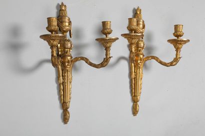 
A pair of chased and gilt bronze sconces...