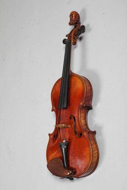 
Violin with case and bow
Neck carved with...