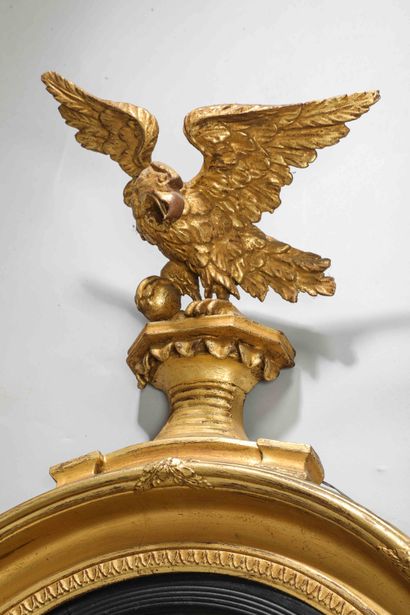 
A large wood and gilded stucco mirror frame,...