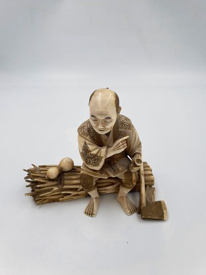 
Ivory OKIMONO representing a character sitting...