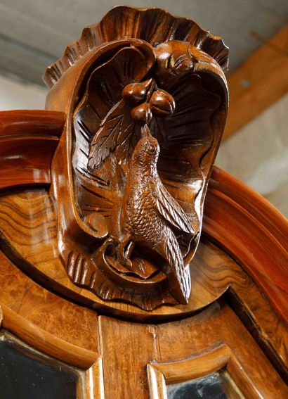
A burl wood veneer display cabinet opening...