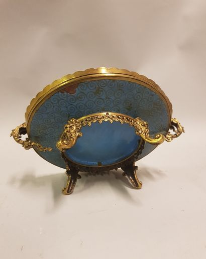 
A gilt bronze cup with a dish decorated...