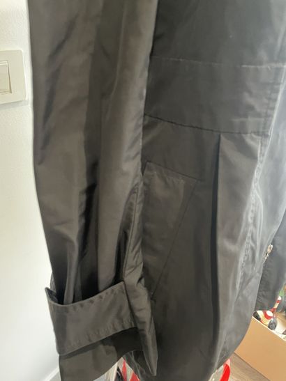 MONCLER
Black raincoat with chrome metal...