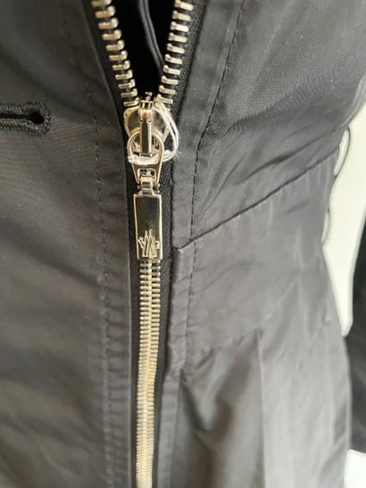 MONCLER
Black raincoat with chrome metal...