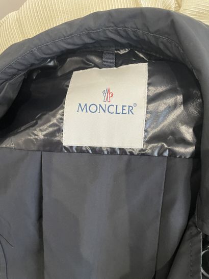 MONCLER
Black raincoat with chrome metal...