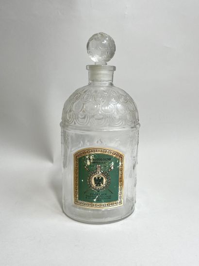 GUERLAIN
Moulded glass bottle with bee model...