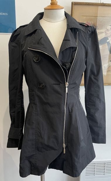 MONCLER
Black raincoat with chrome metal...