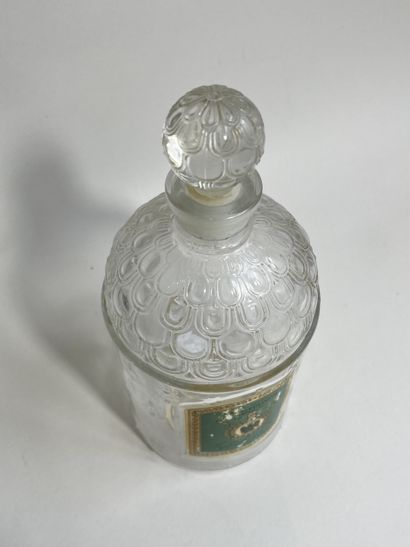 GUERLAIN
Moulded glass bottle with bee model...