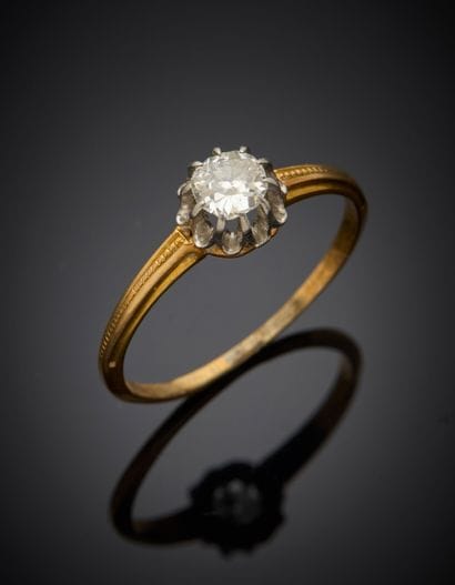 Solitaire in 18K 750‰ two-tone gold and 850%...