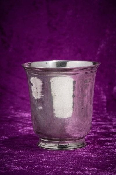 A plain silver tulip-shaped kettledrum, the...