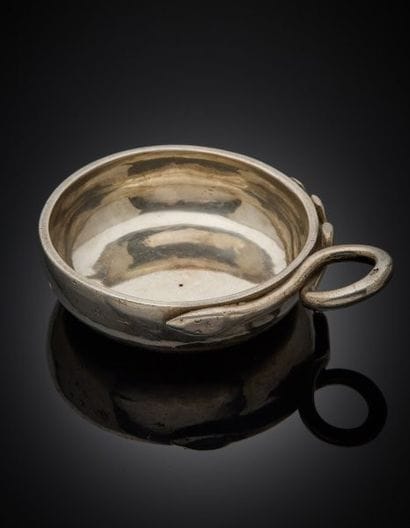Round, plain silver wine cup with coiled...