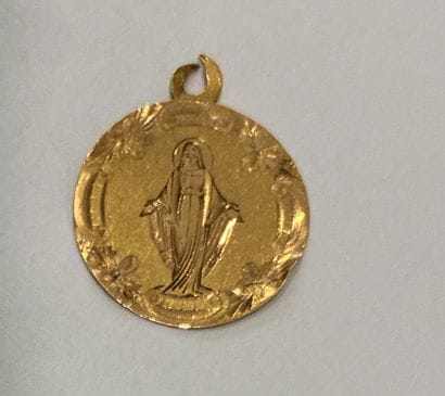 MEDAL in 18K (750 thousandths) yellow gold,...