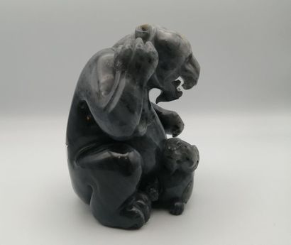CHINA, 20th century. Group in grey jade representing...