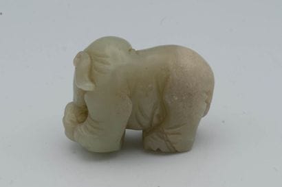 CHINA, early 20th century. Celadon jade elephant....