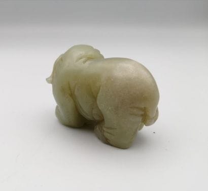 CHINA, early 20th century. Celadon jade elephant....