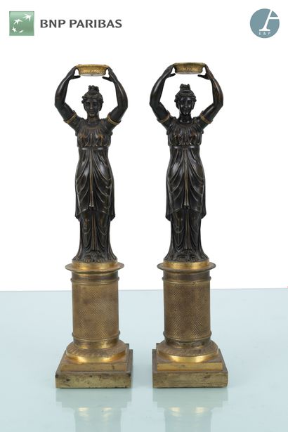 Pair of candelabras with draped women in...