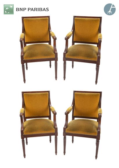 Set of four armchairs in natural wood molded...