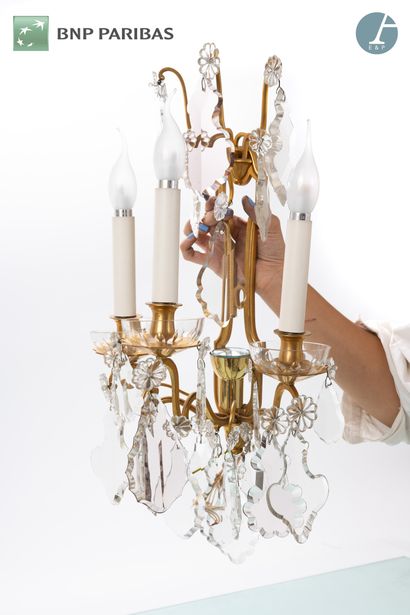Pair of ormolu and chased sconces with three...