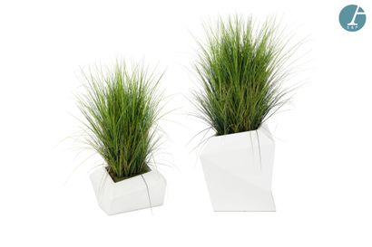 Set of two white plastic planters with cut...