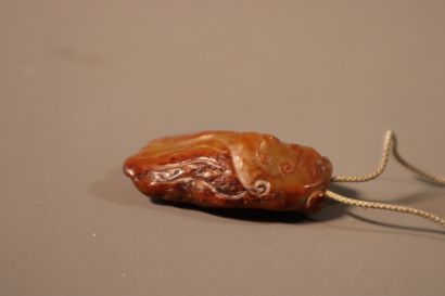 CHINA, 18th century
Pendant in rusty nephrite
in...