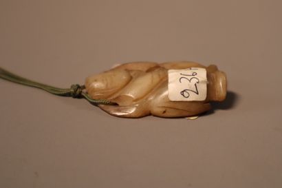 CHINA, About 1900
Three jade (nephrite) pendants...